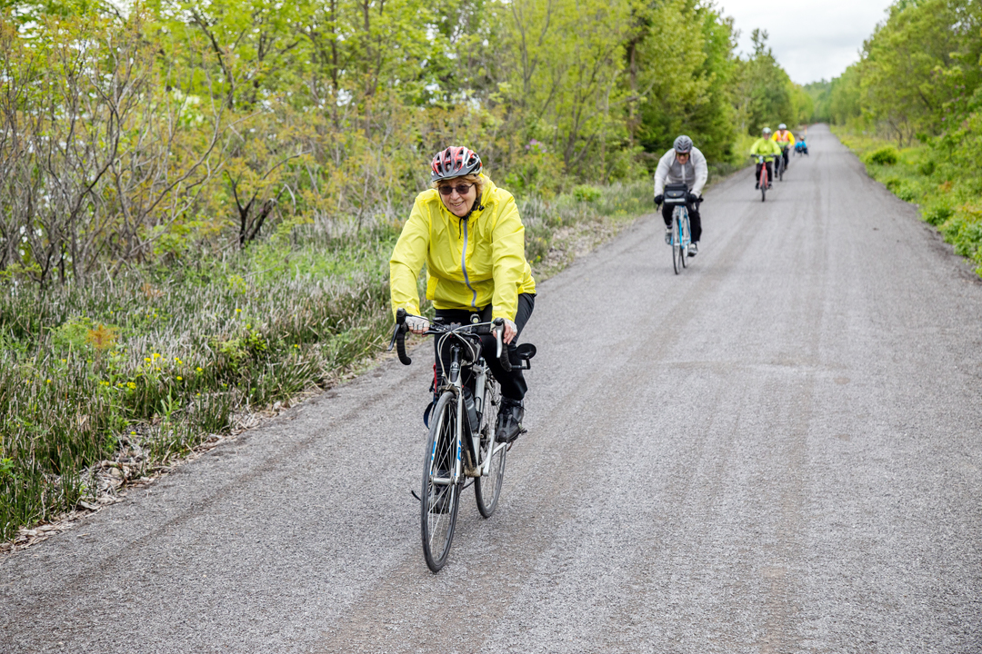 Cyclists riding on a stone dusted trail