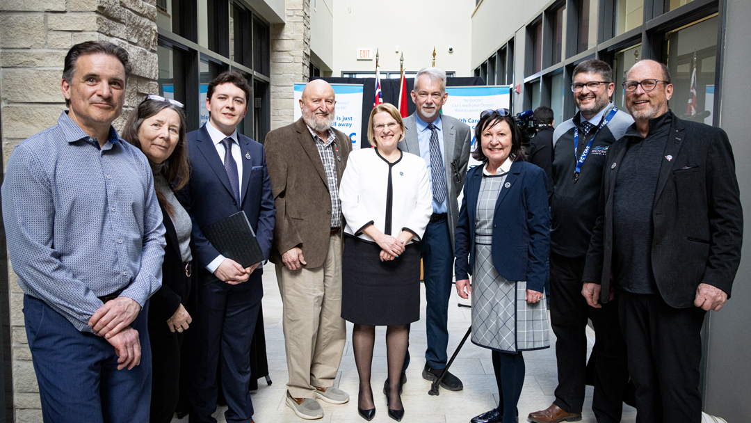 Members of County Council, MPP Denault and Minister Jones standing in a line