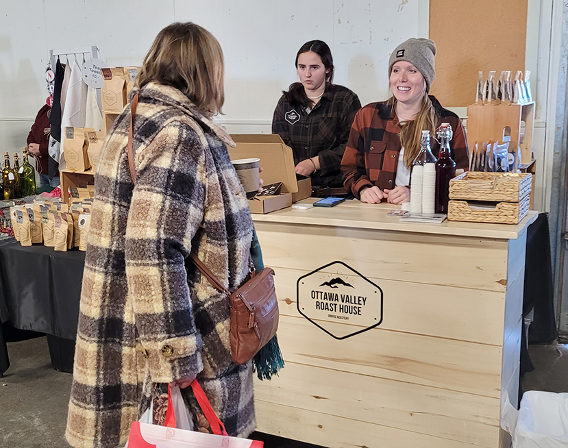customer stopped at a vendor booth at a previous Taste of the Valley market