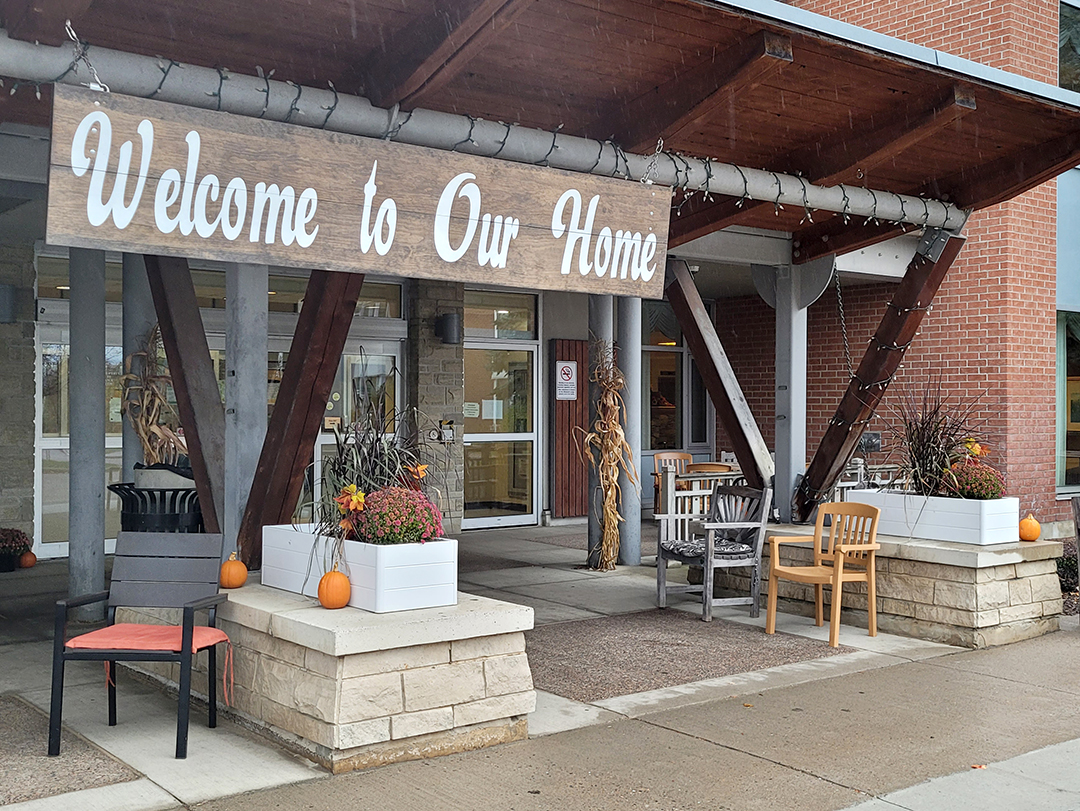 front entrance of Miramichi Lodge - large sign that says Welcome to our Home