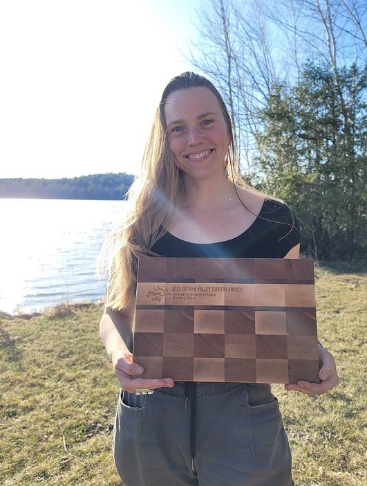 Rachel Braiding Rivers with award