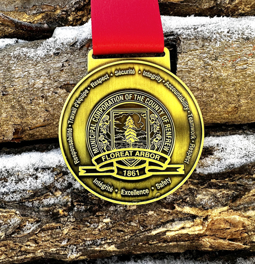 OWG medal with logs