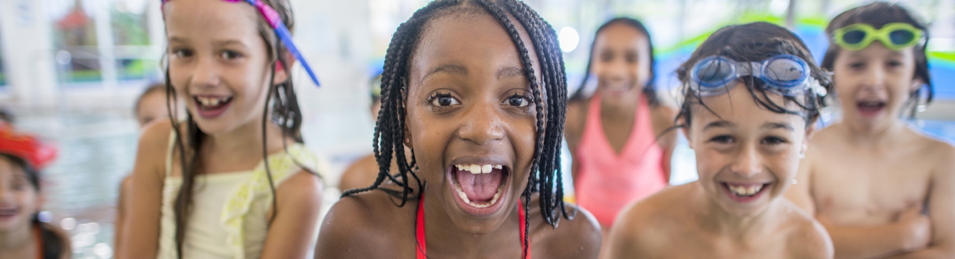 Kids having fun at a public swimming pool